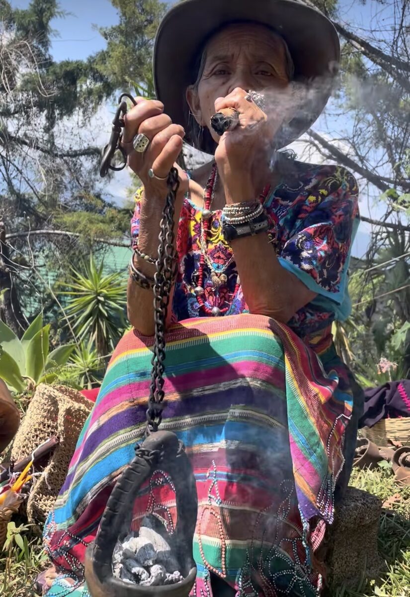 Guatemalan abuela performing a copal smoke offering