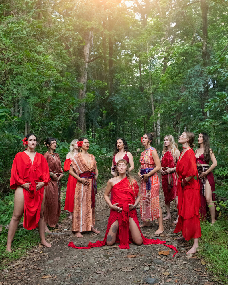 Retreat memory: women in red in the forest
